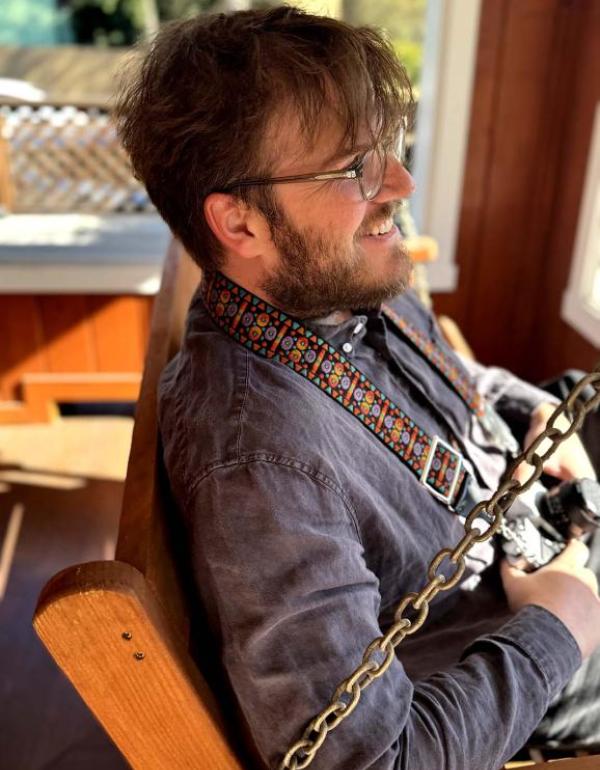 Nathan Hertz sits and smiles.