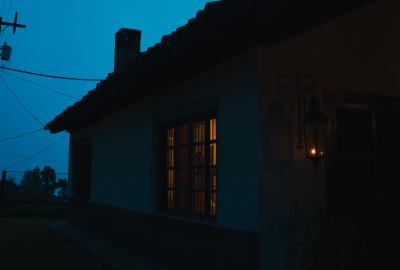 A house at night with the lights on