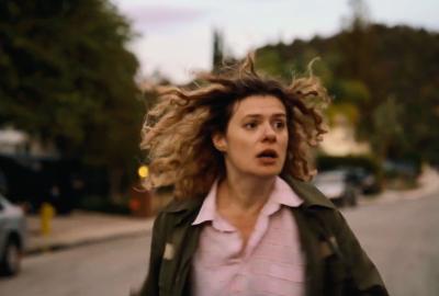 A woman moving fast in fear