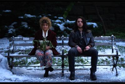 Brenda and Billy sit on a bench in the park