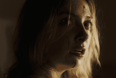 The protaganist looks on