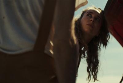 A woman gets help with her broken down car