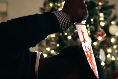 Bloody knife being thrust into someone