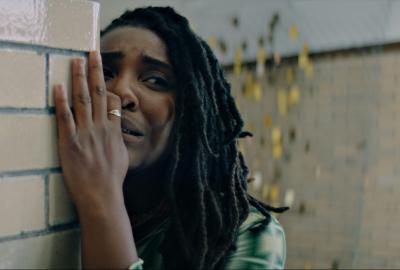 A scared woman hides