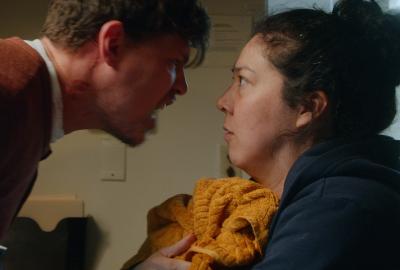 A man yells at a women close up