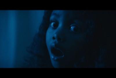 A young girl looks scared