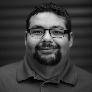 Black and White headshot of Director PJ Germain